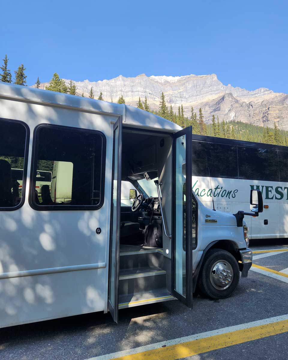 The Moraine Lake Bus Company Shuttle with its doors open Canada