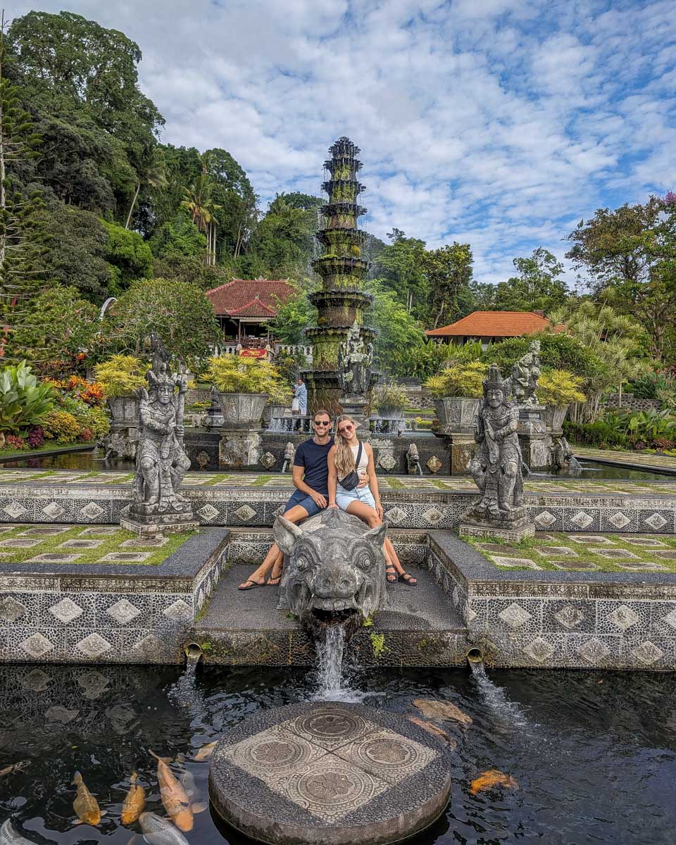 Bailey and Daniel pose for a photo at Tirta Gangga on the instagram tour in Bali