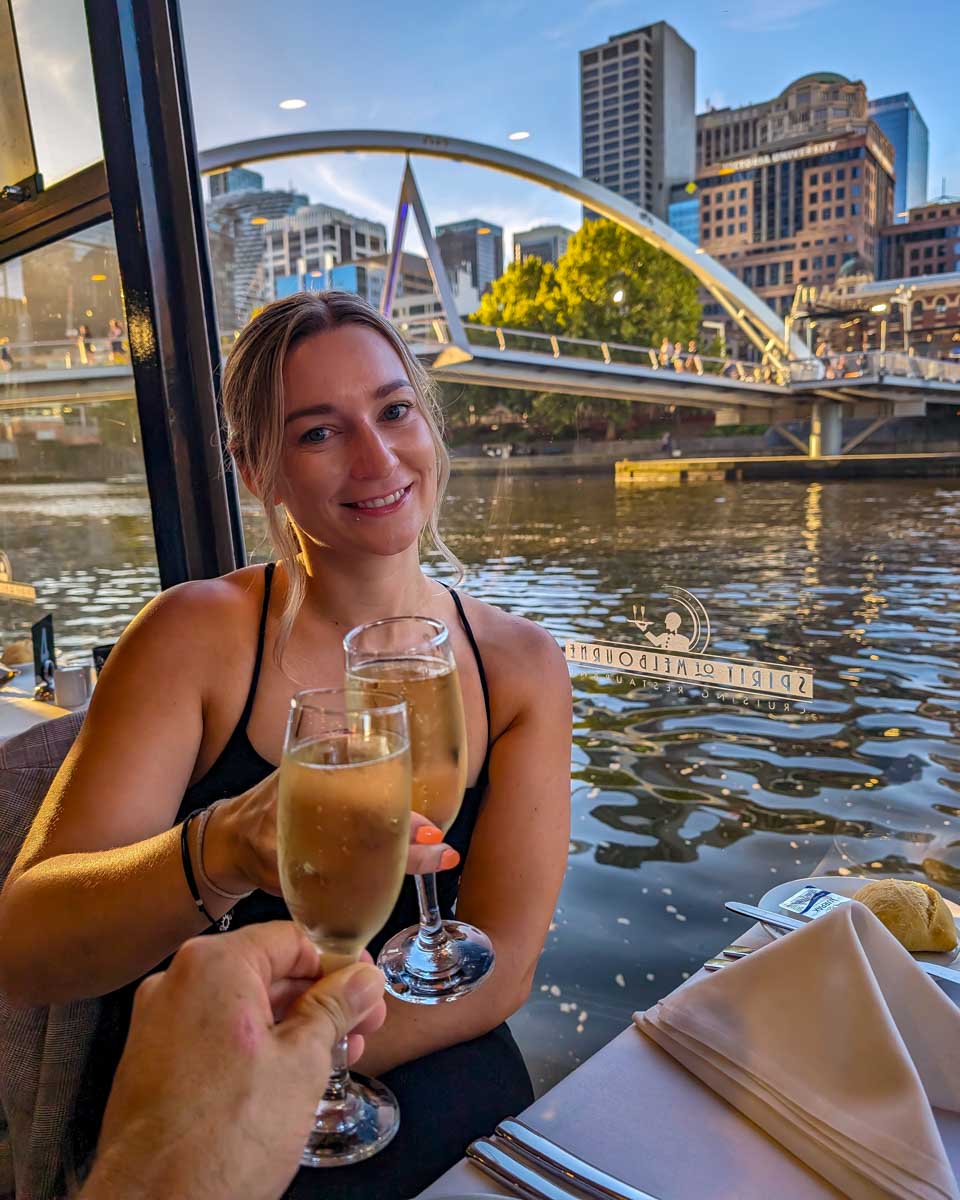 Bailey cheers her wine on the spirit of melbourne dinner druise