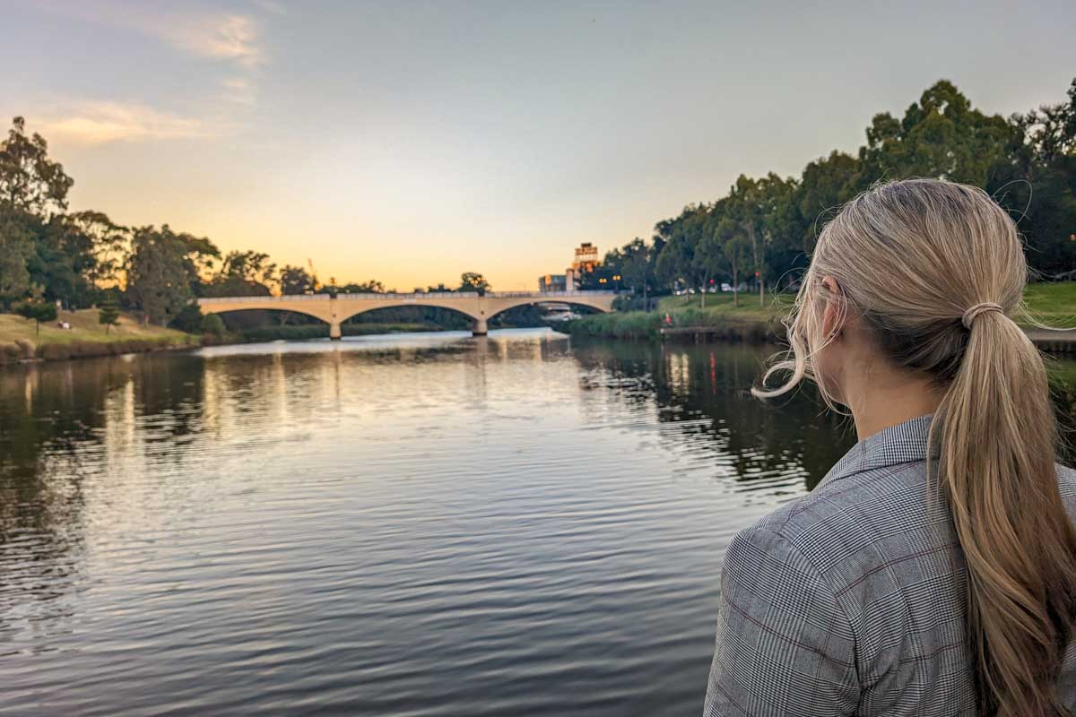 Bailey looks out over the water during sunset during the spirit of melbourne dinner cruise