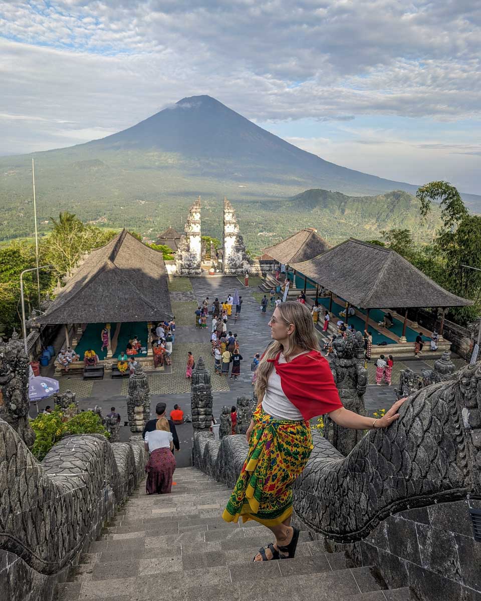 Bailey stands on the stairs leading to Lempuyang Temple during the instagram tour in Bali