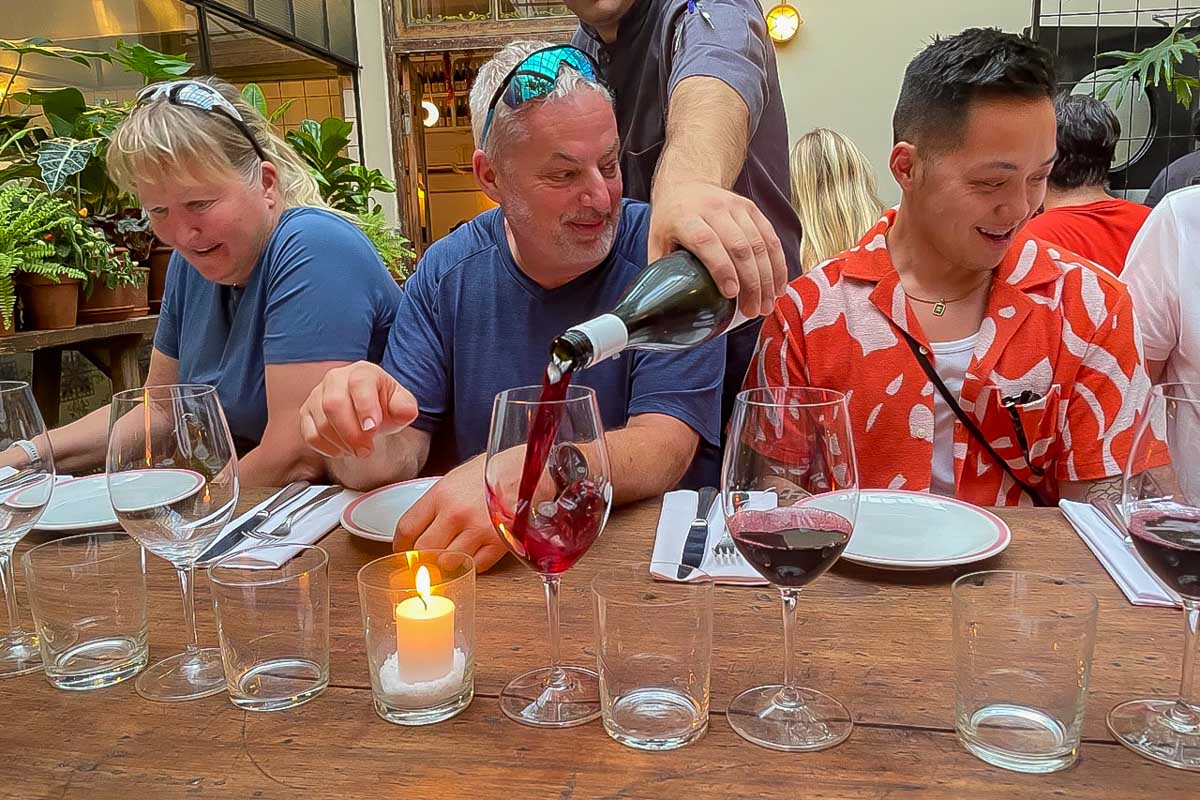 People drink wine on a sherpa food tour in Buenos Aires Argentina