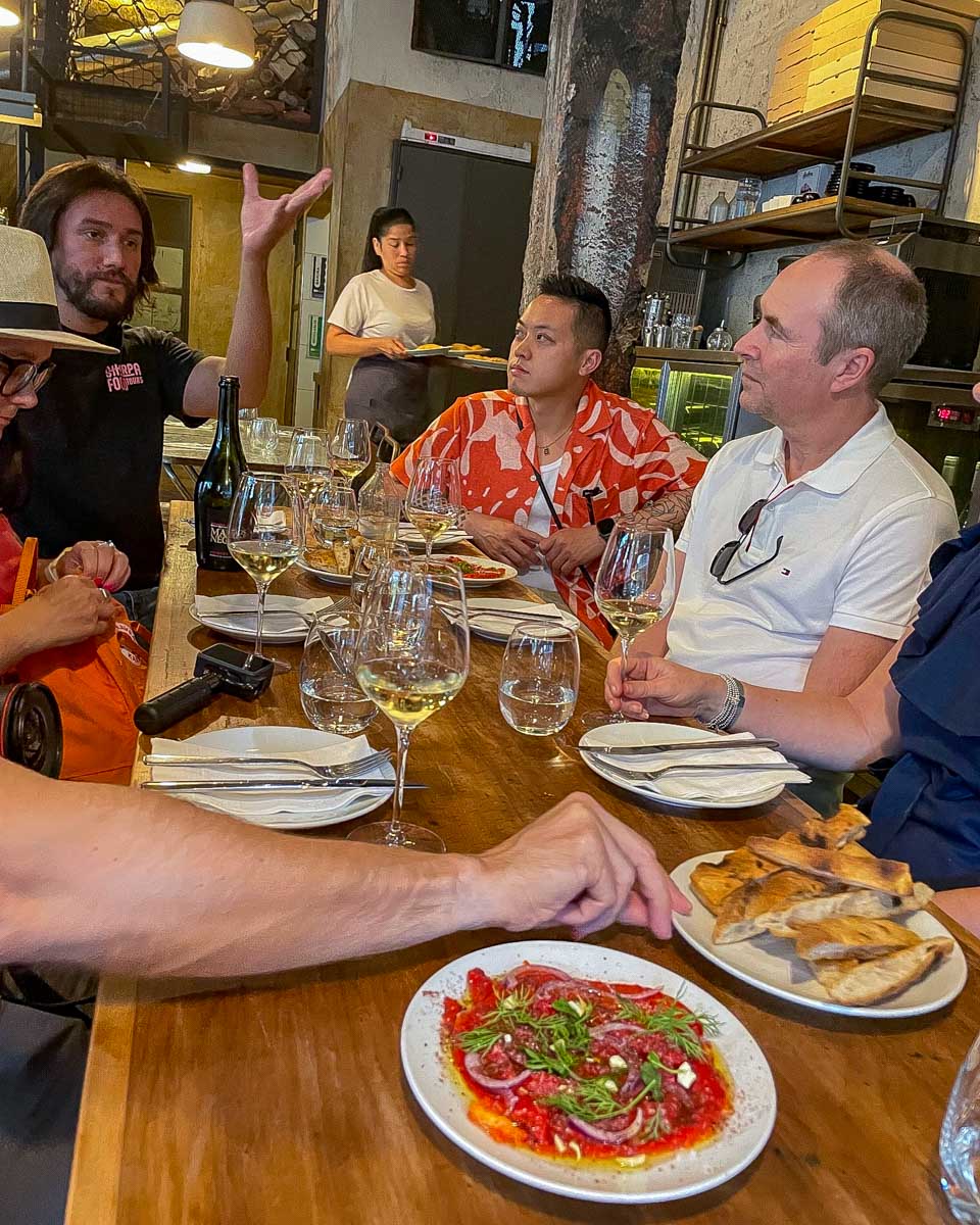 People enjoy a meal on a sherpa food tour in Buenos Aires Argentina