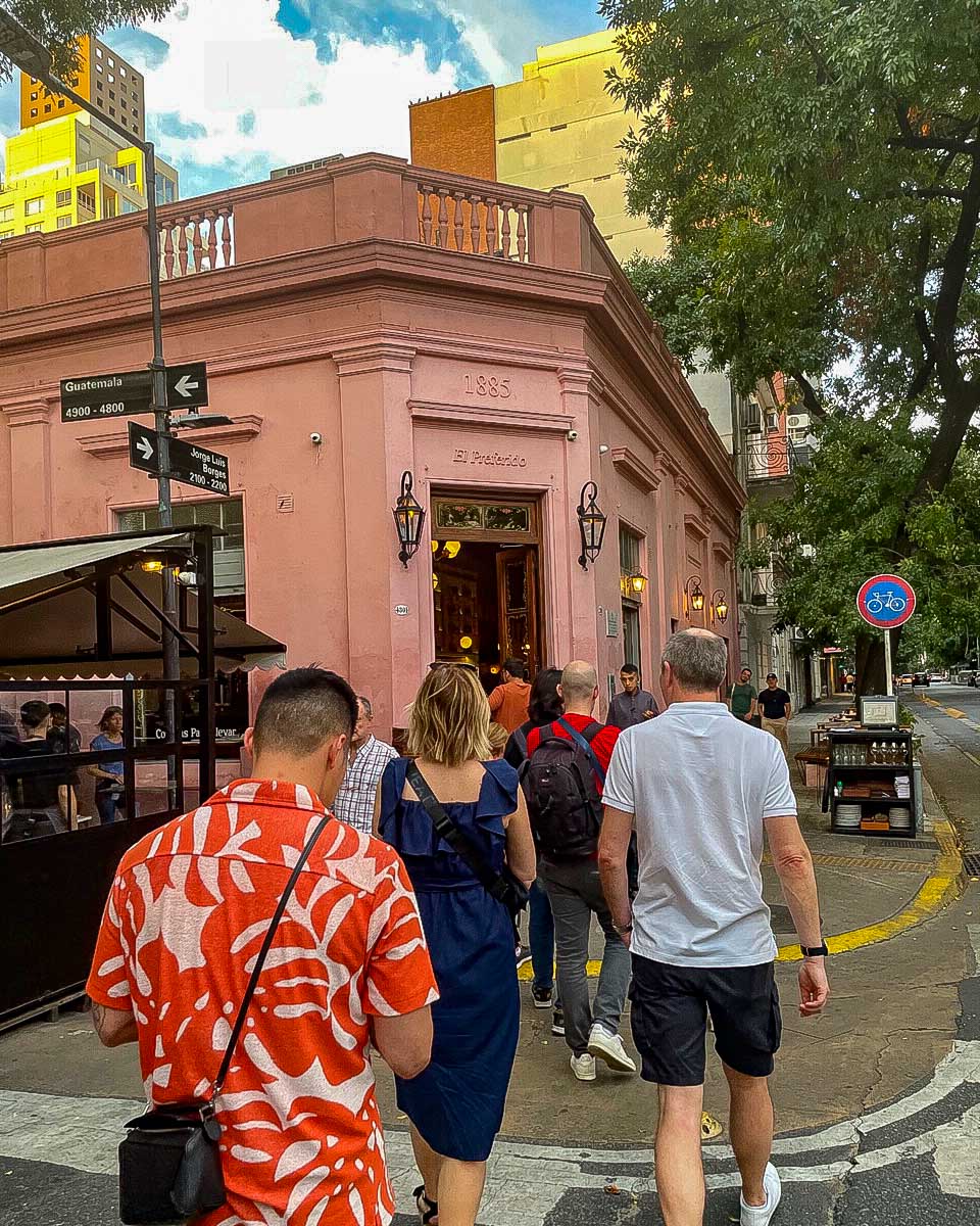 People walk to a restaurant on a sherpa food tour in Buenos Aires Argentina