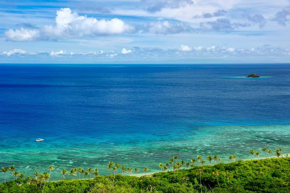 A beautiful beach seen from a cliff on a multi day cruise fiji
