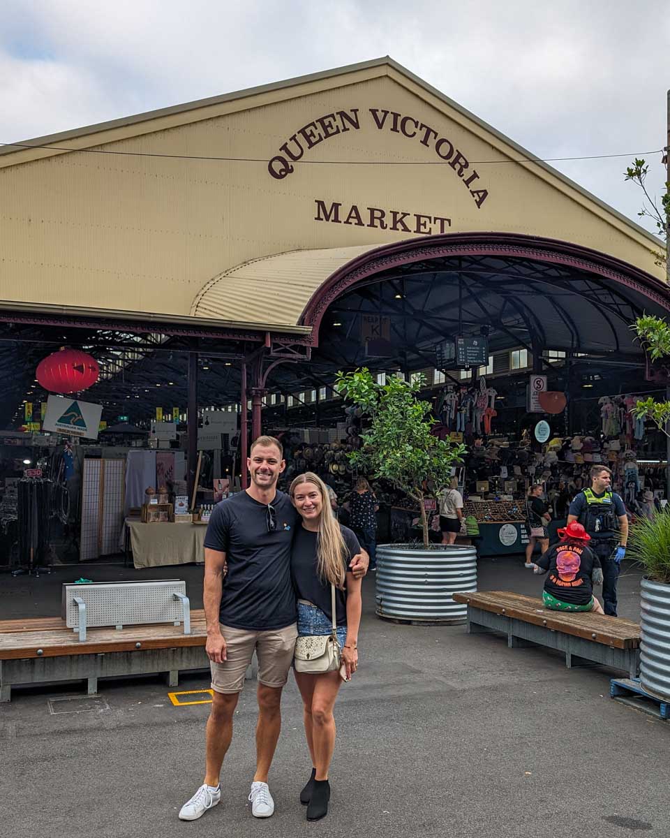 Bailey and Daniel pose for a photo outside the Queen Victoria Market in Melbourne, Australia