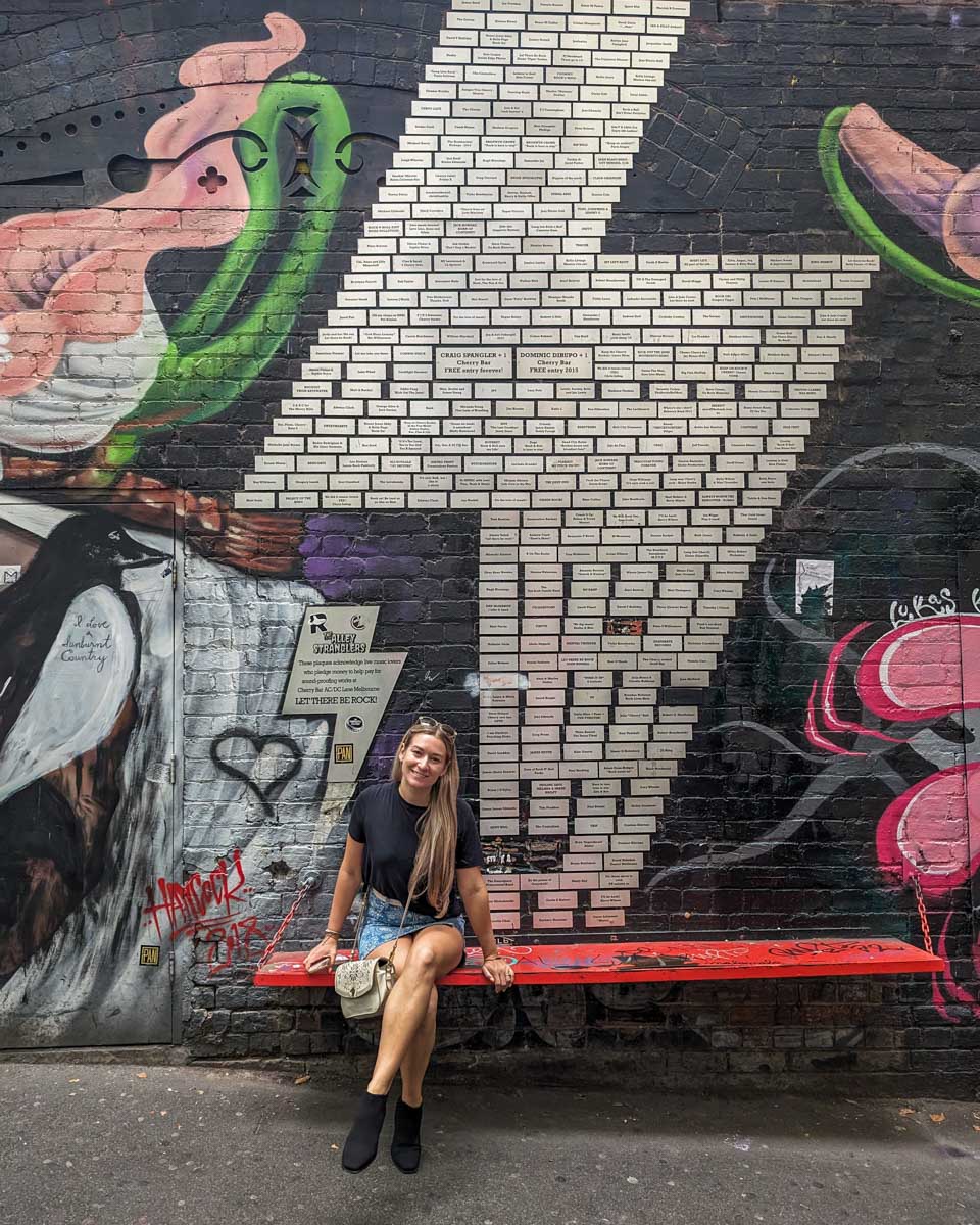 Bailey sits on a bench in ACDC lane in Melbourne