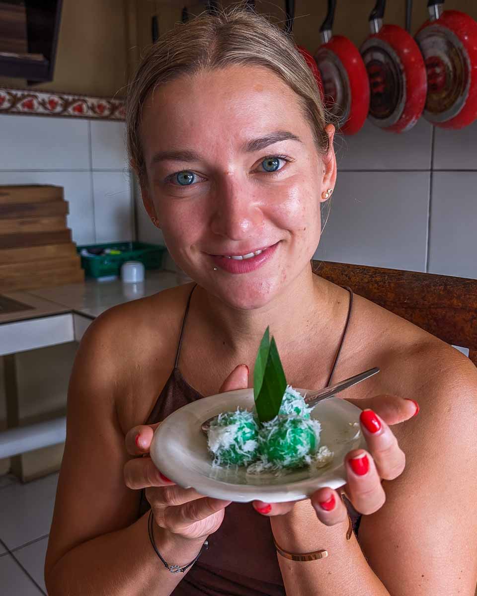 Bailey tries a traditional dessert on a food tour in Bali Indonesia