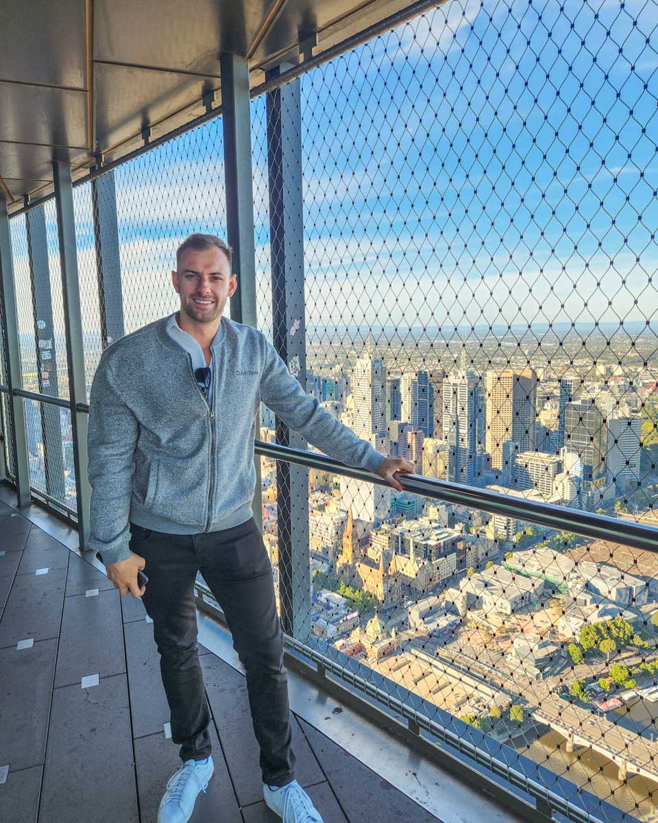 Daniel poses for a photo at the Melbourne Skydeck