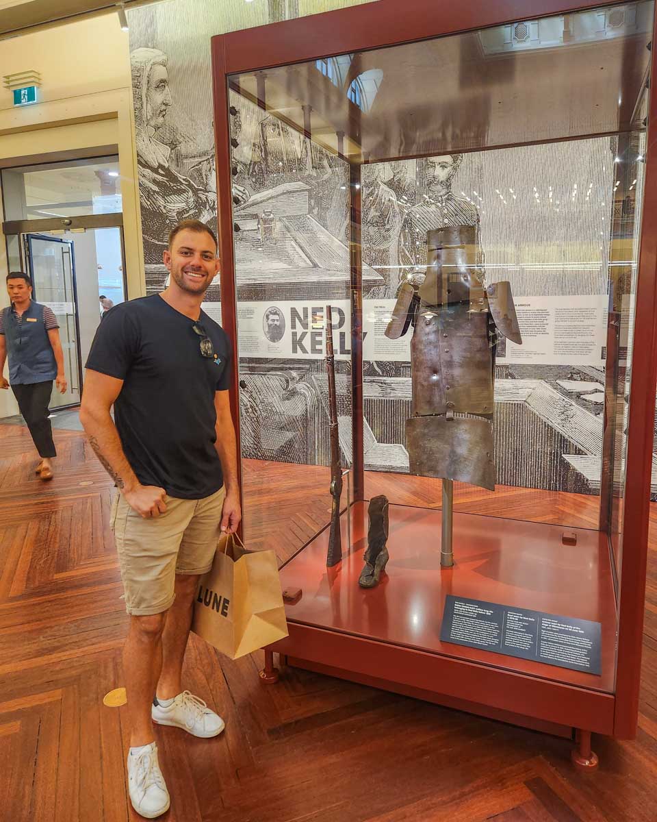 Daniel poses with the Ned kelly Armor inside the Victoria State Library in Melbourne Australia