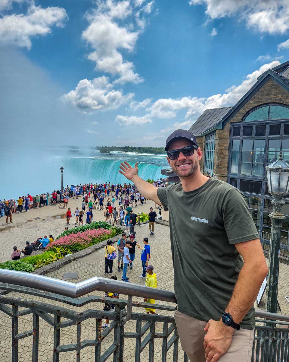 Daniel smiles at Niagara Falls Canadian side on a klook tour