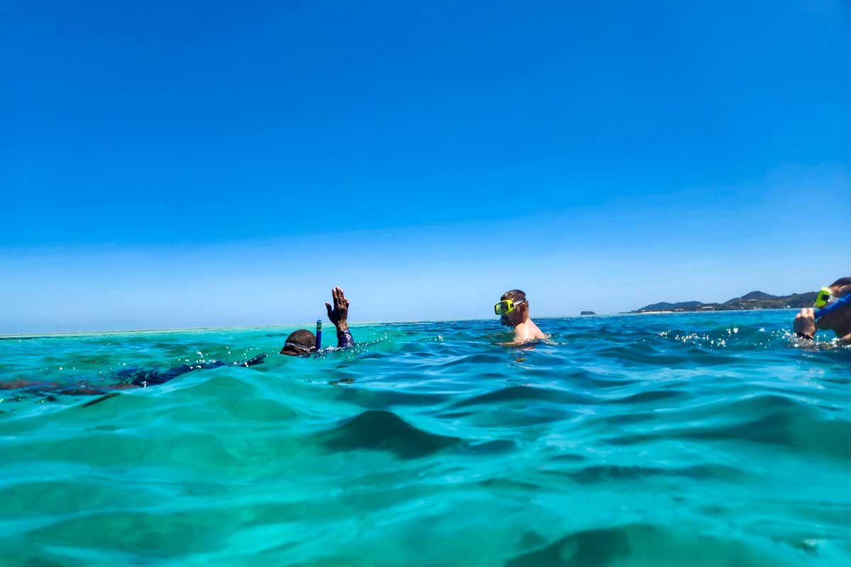 People snorkel on a multi day cruise Fiji