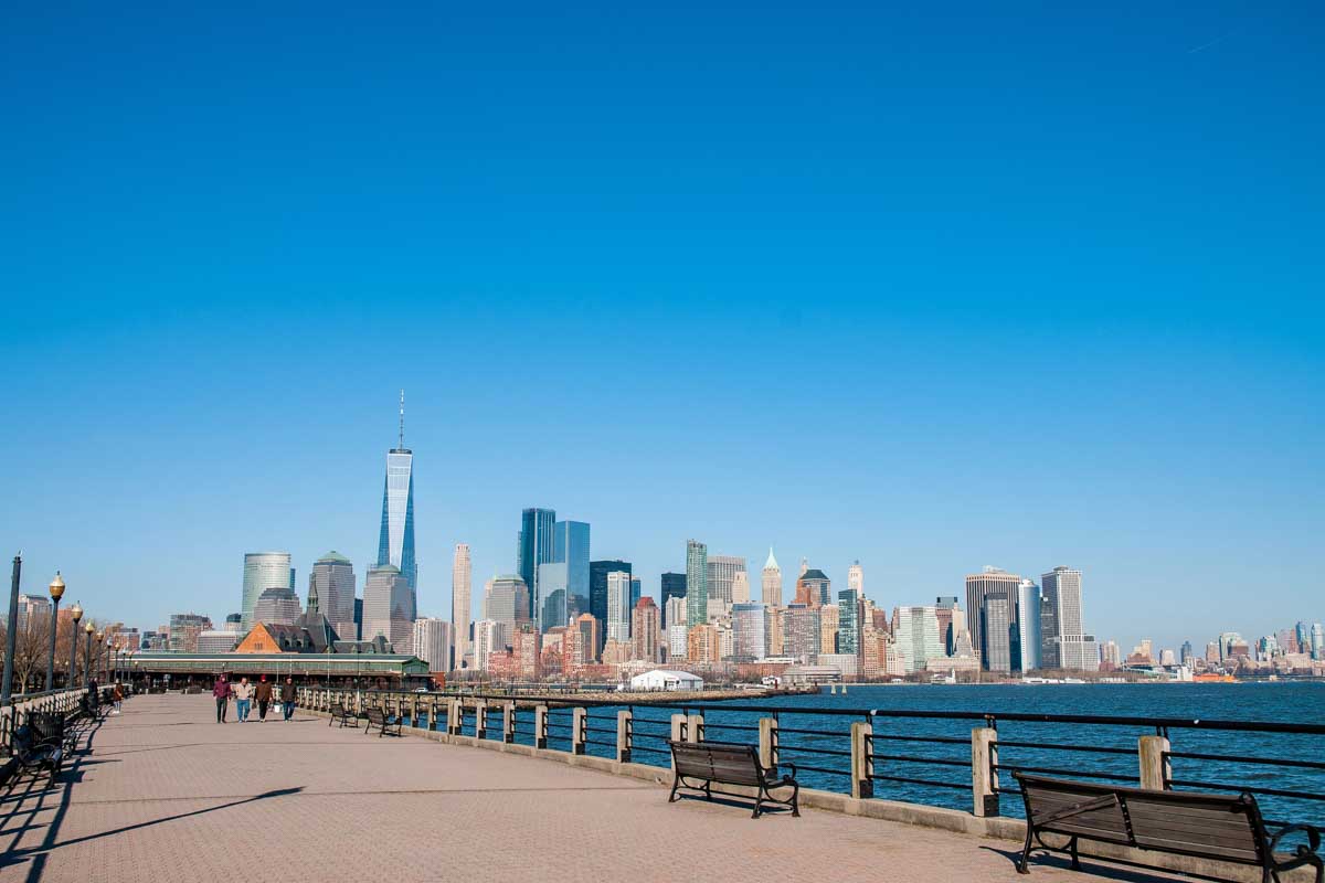 The Liberty State Park waterfront walkway in Jersey with views of New York City