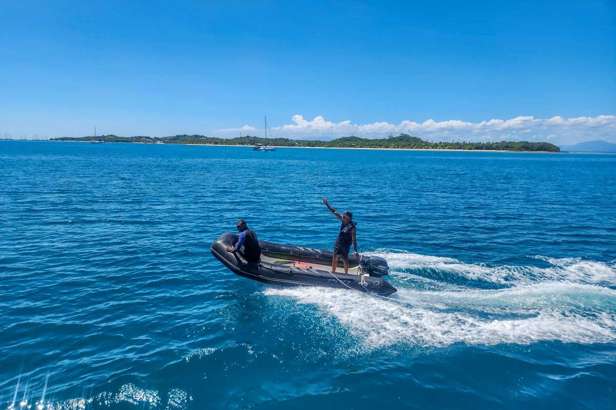 Two men on a boat during a multi day cruise fiji