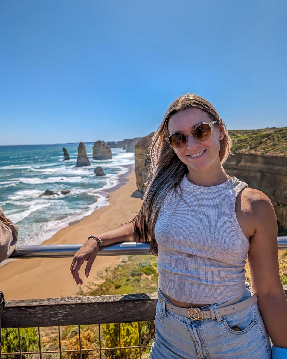 Bailey smiles at the Twelve Apostles on the Great Ocean Road