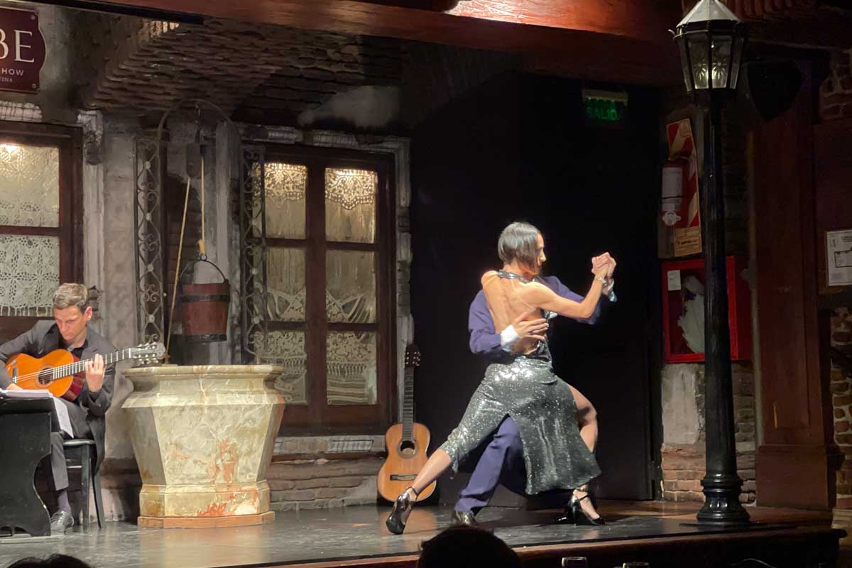 A woman and man tango at La Ventana Buenos Aires Argentina