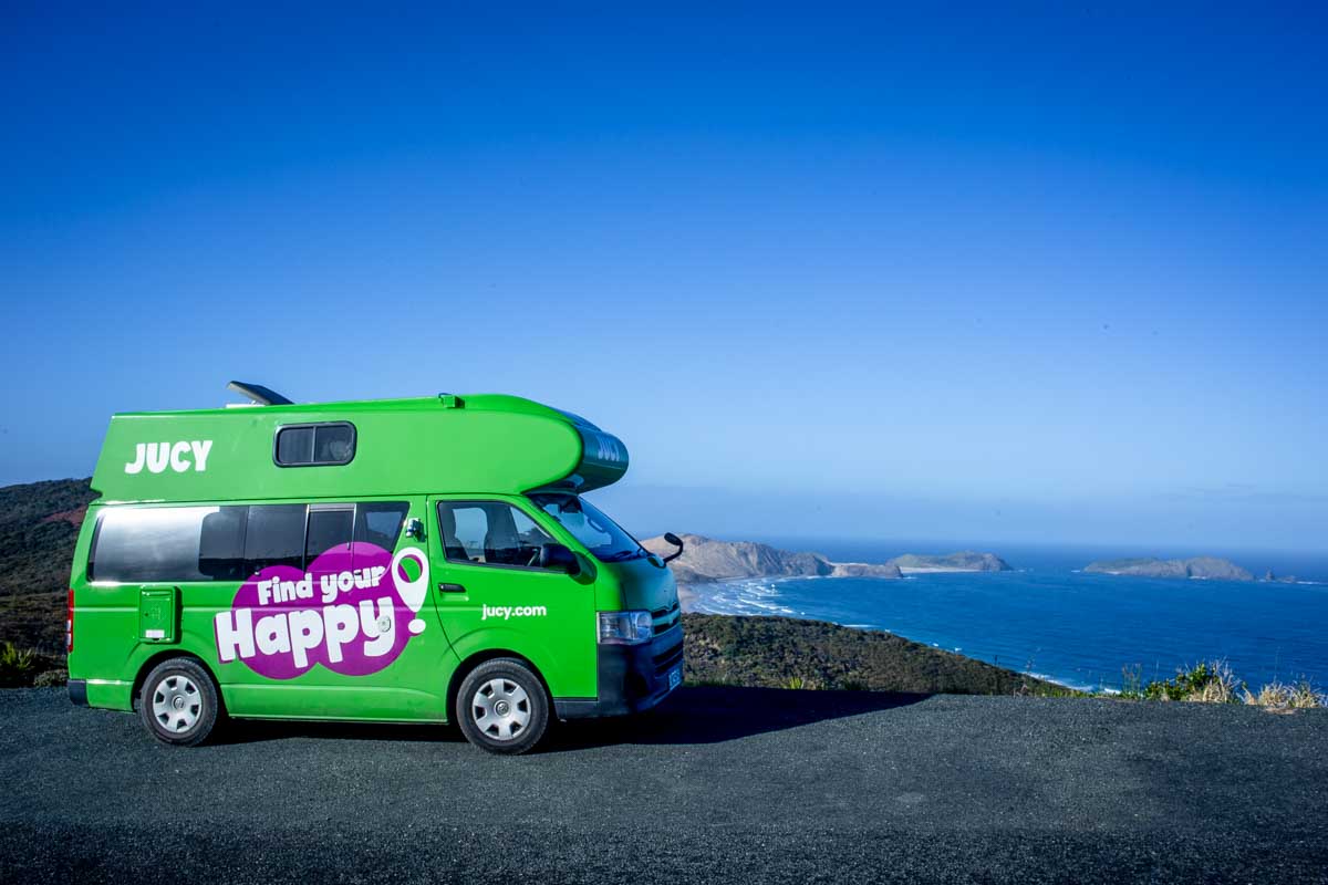 A-jucy-campervan-overlooking-the-ocean-in-Australia