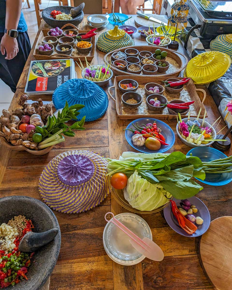 A large table with various cooking supplies during a cooking class in Ubud Bali