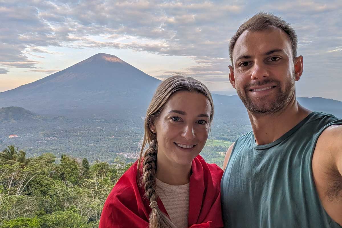Bailey and Daniel take a selfie at Lempuyang Temple with Mount Agung in the background Bali