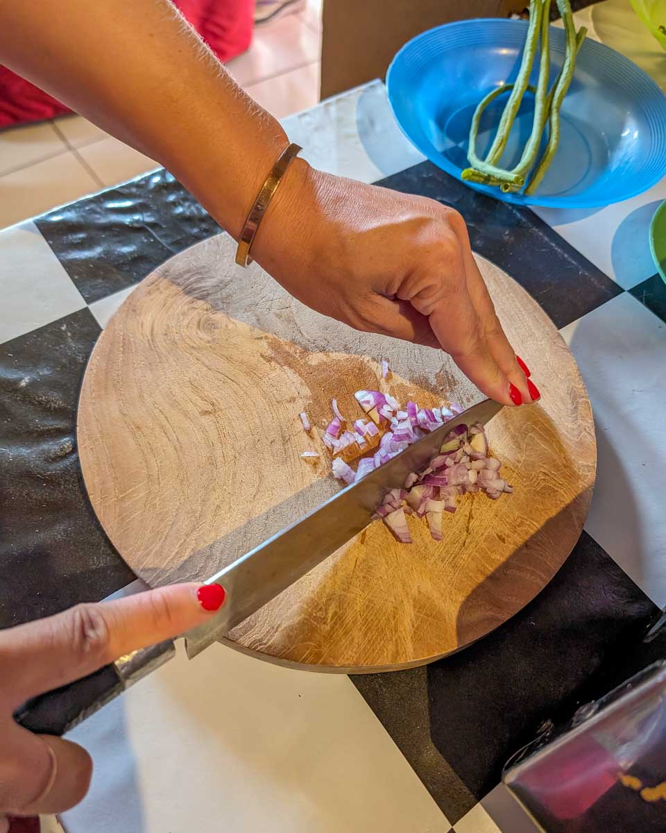 Bailey chops vegtables during a cooking class in Ubud Bali