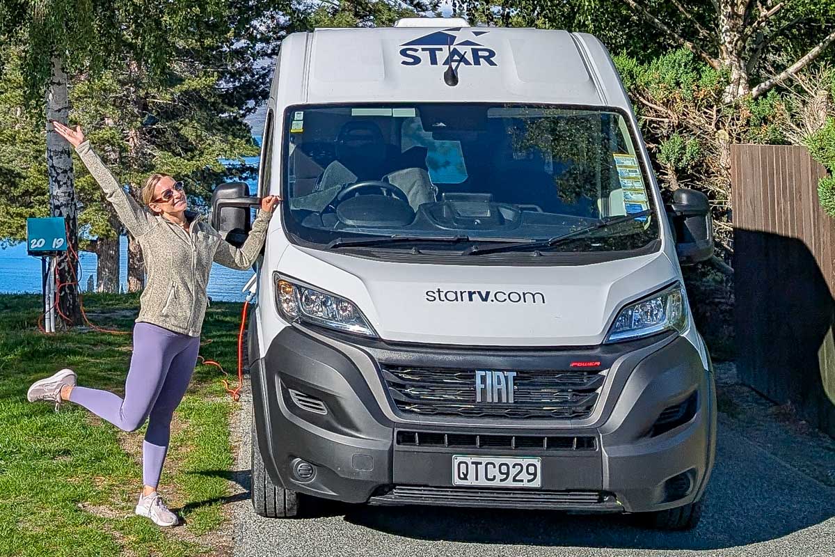 Bailey stands with a Star RV campervan in New Zealand 2