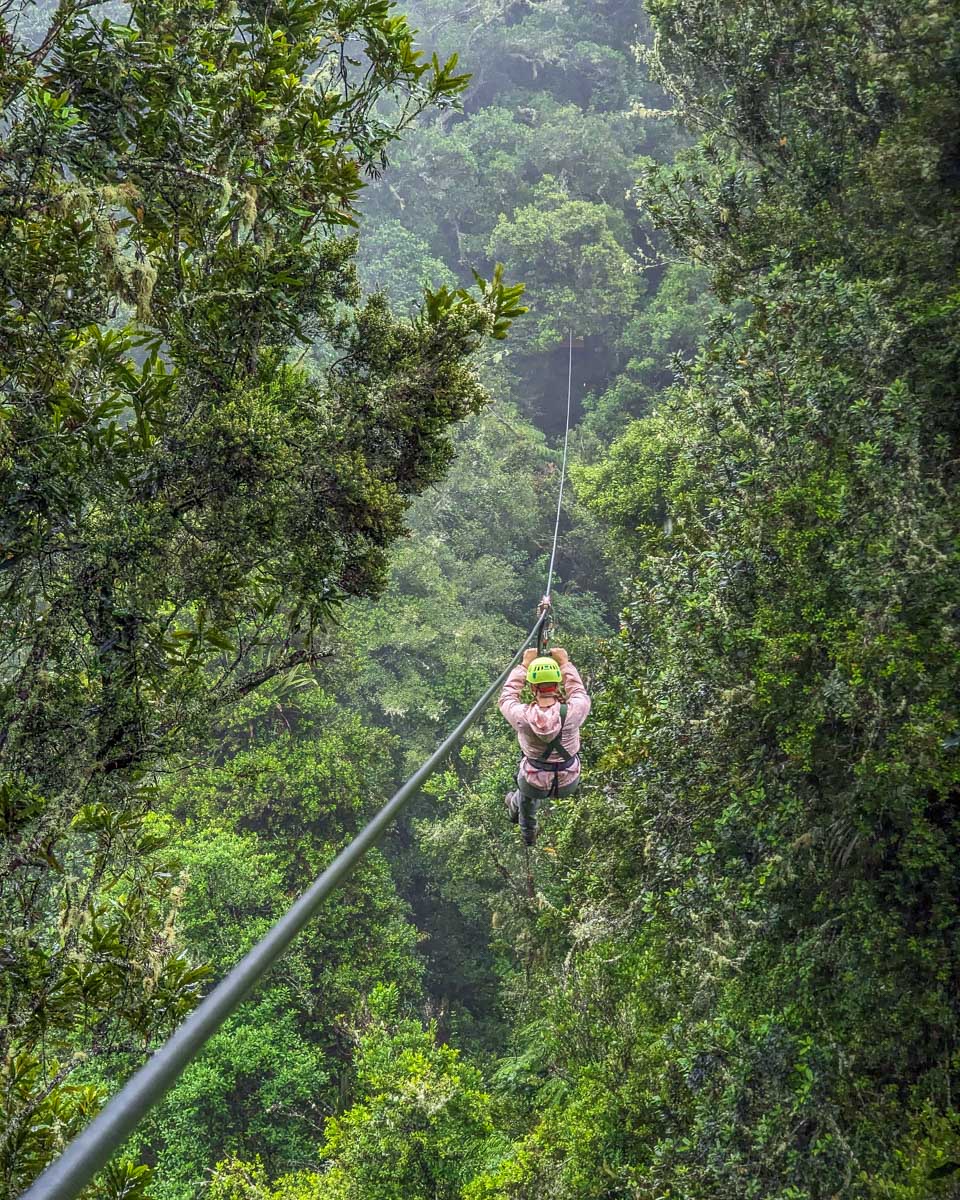 Bailey ziplines with smile near Banos Ecuador