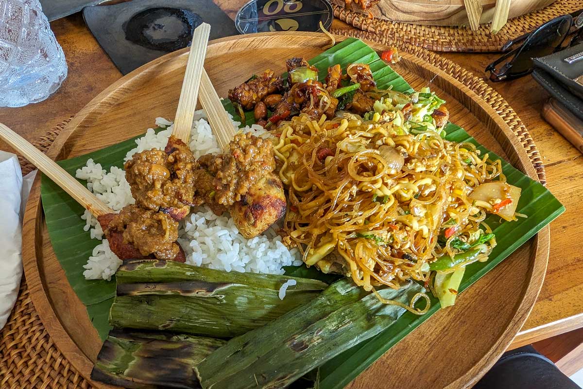 Rice meat and vegtables on a banana leaf made during a cooking class in Ubud Bali