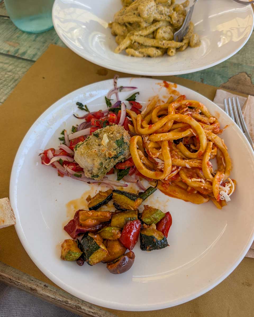 A plate of food made during a cooking class in Taormina Italy