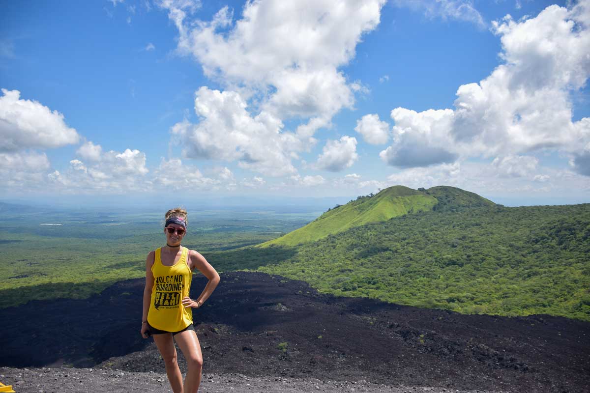 Bailey poses at the top of Cerro Negro while volcano boarding in Nicaragua