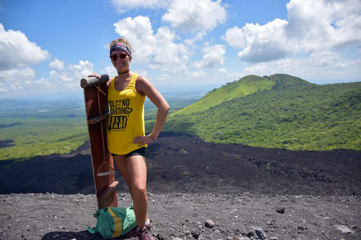 Bailey poses with her board at the top of Cerro Negro while volcano boarding in NIcaragua