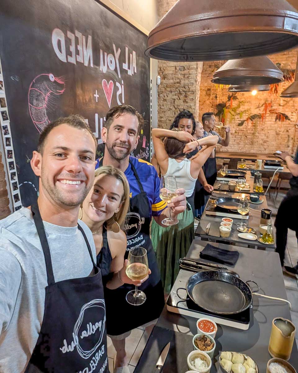 Daniel and Bailey smiling in a kitchen during a Paella making class in Barcelona Spain