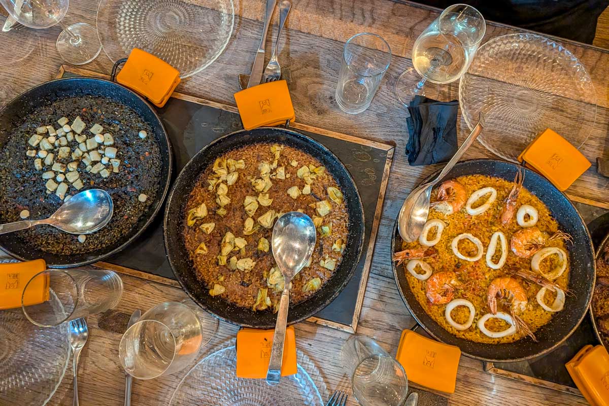 Two pans of paella during a Paella making class in Barcelona Spain