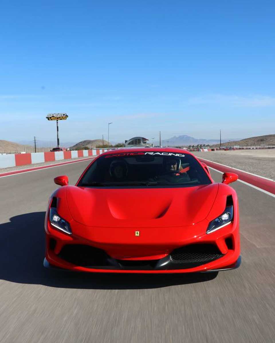 A red car on a track in Las Vegas USA Exotics Racing
