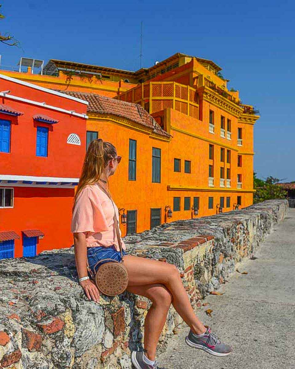 Bailey-sits-on-the-fort-wall-in-Cartagena-Colombia