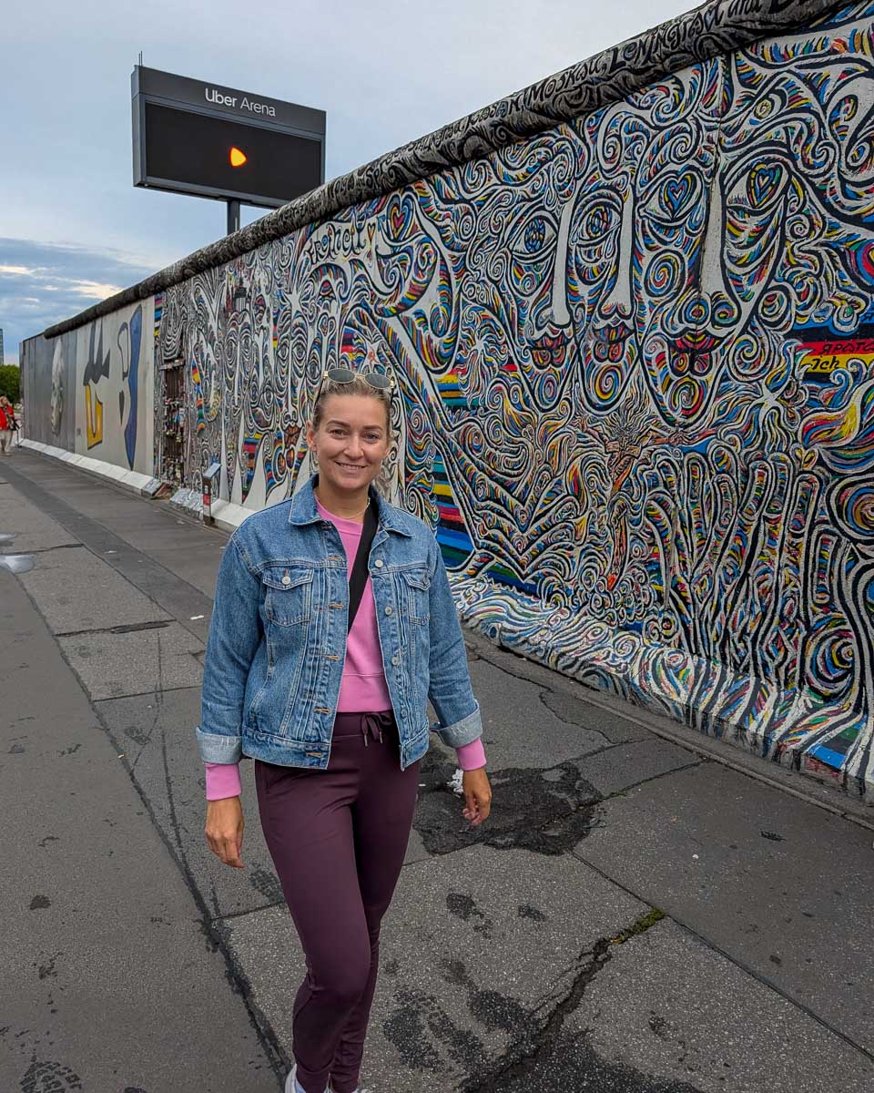 Bailey walks by street art in Berlin Germany
