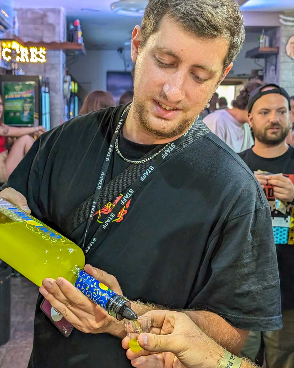 Being poured a drink on a pub crawl in Rome Italy