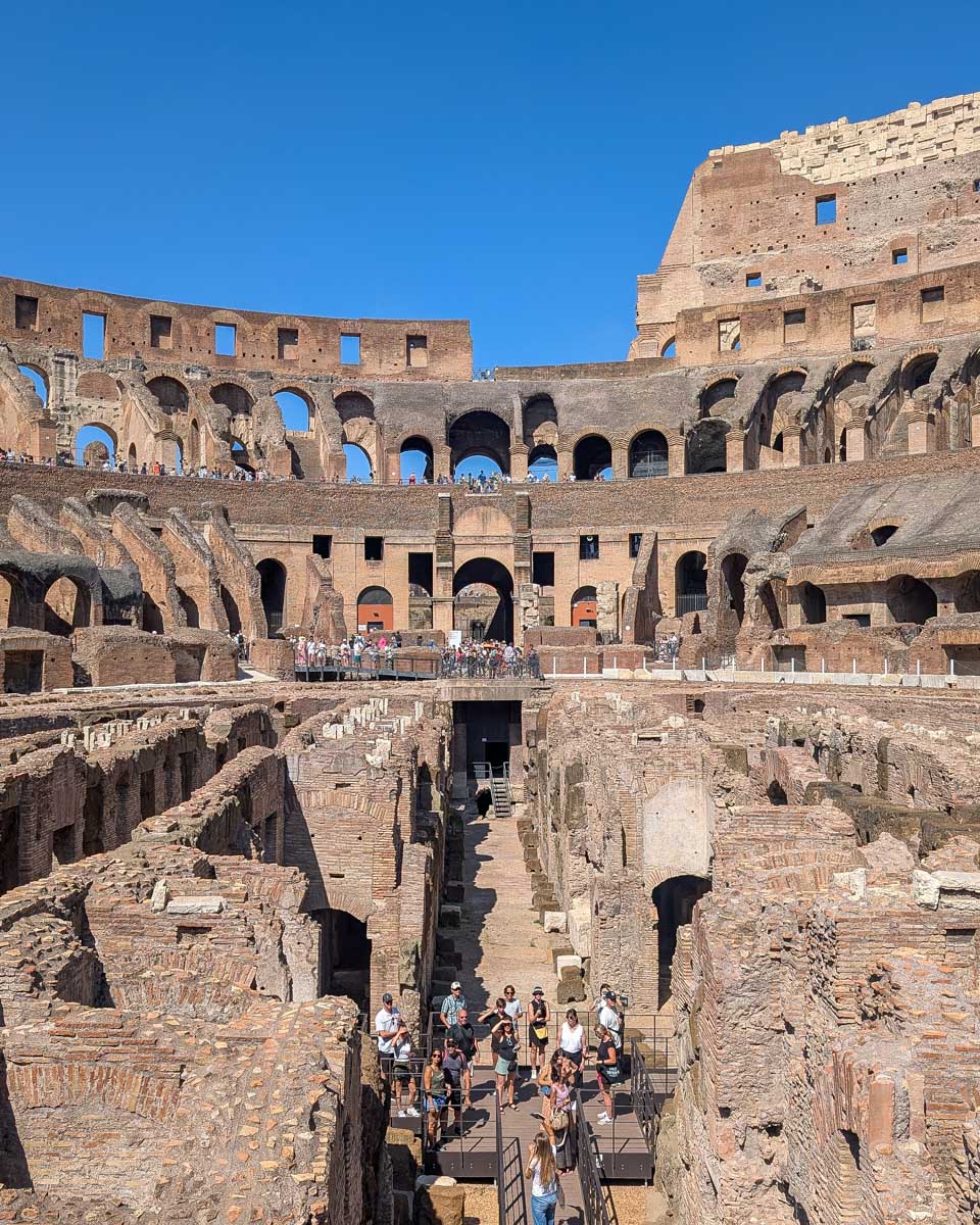 People down in the arena of the colosseum in Rome Italy