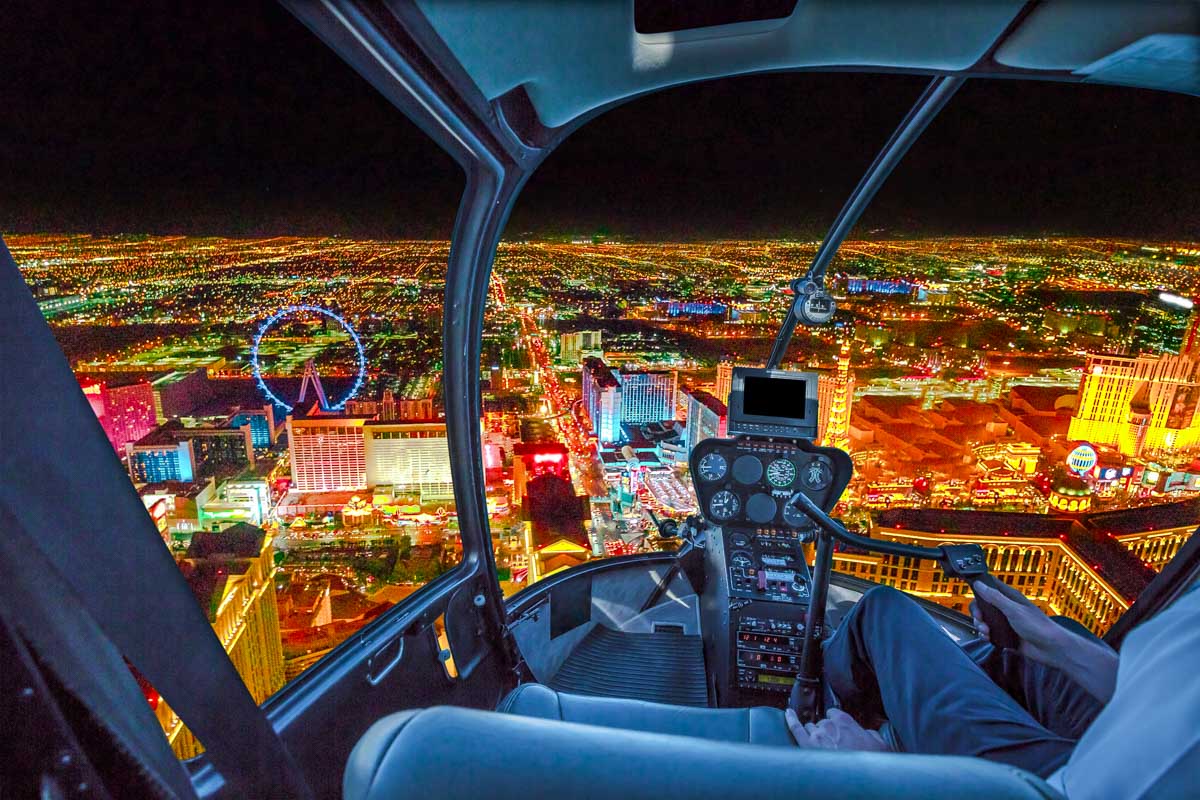 View of helicopter cockpit flying over Las Vegas at night USA