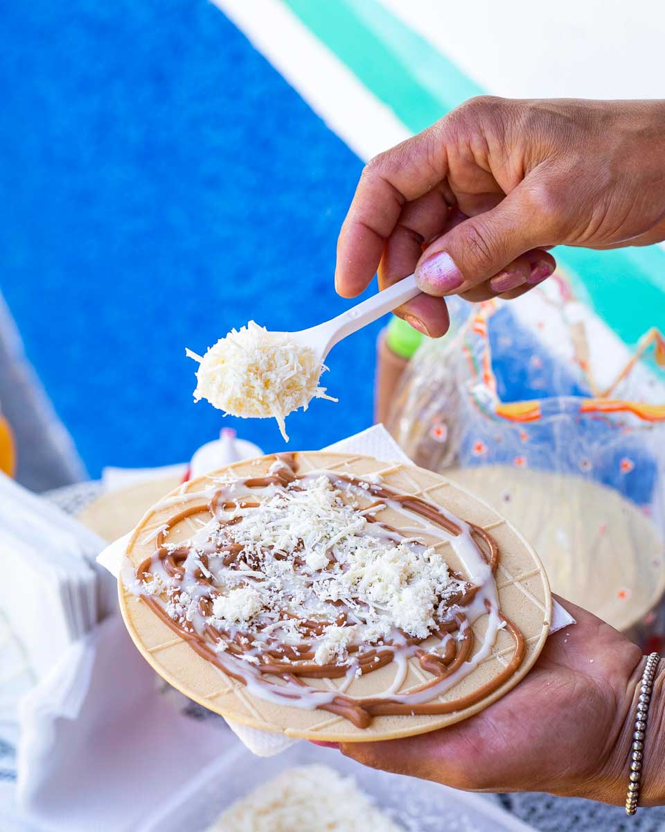 Woman preparing a Obleas dessert in Bogota Colombia