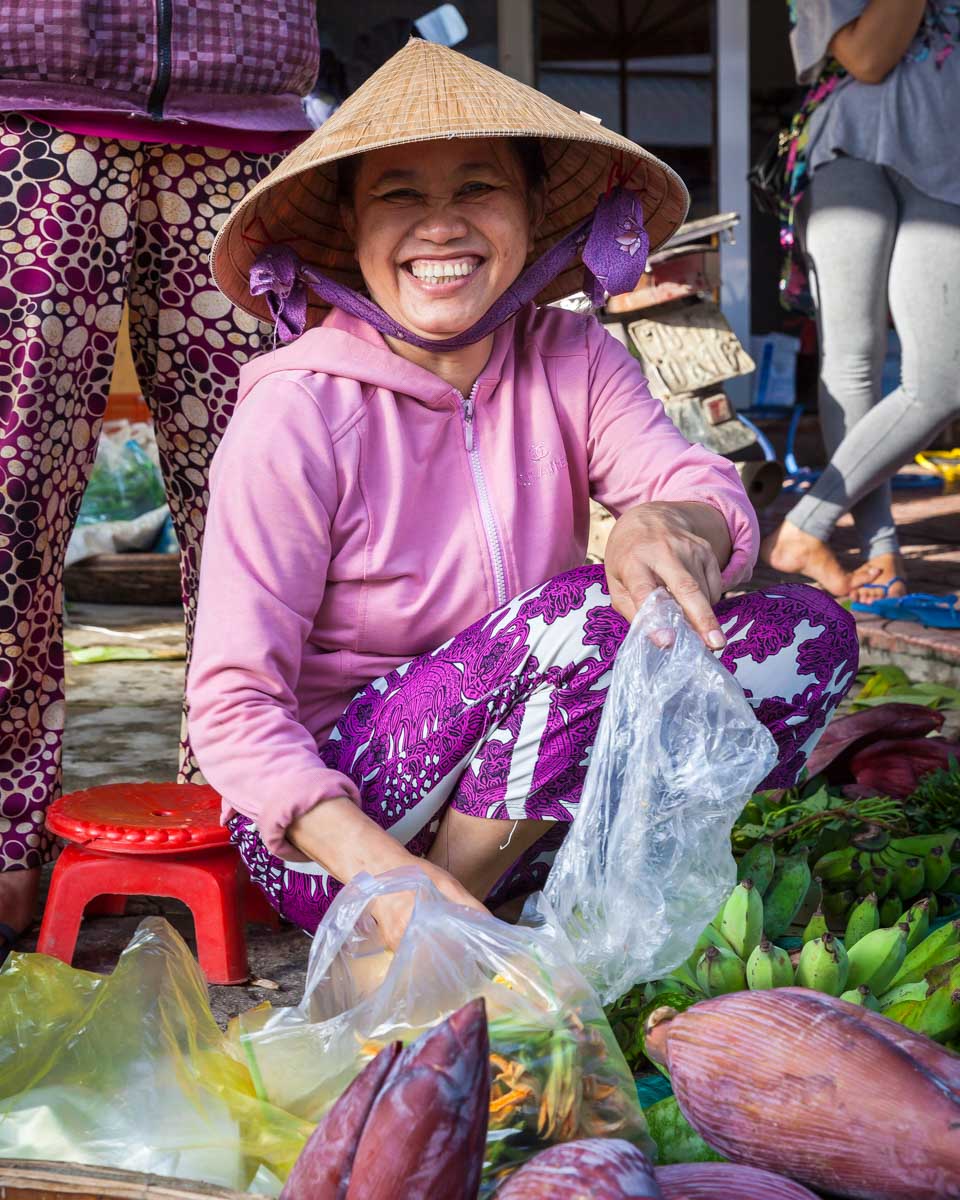 A Vietnamese woman smiles on a tour from Saigon Ho Chi Minh Vietnam