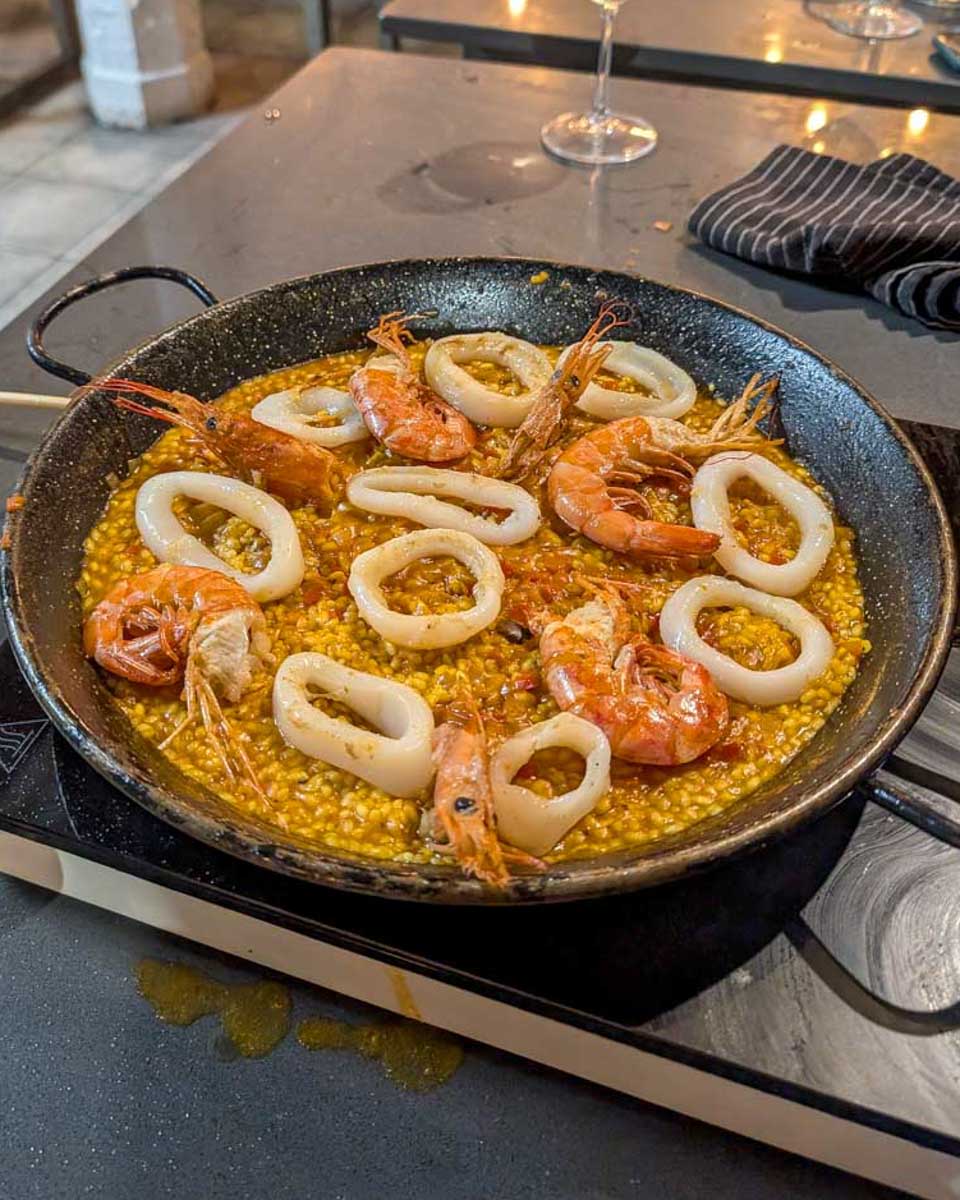 A-pan-with-shrimp-paella-during-a-Paella-making-class-in-Madrid-Spain