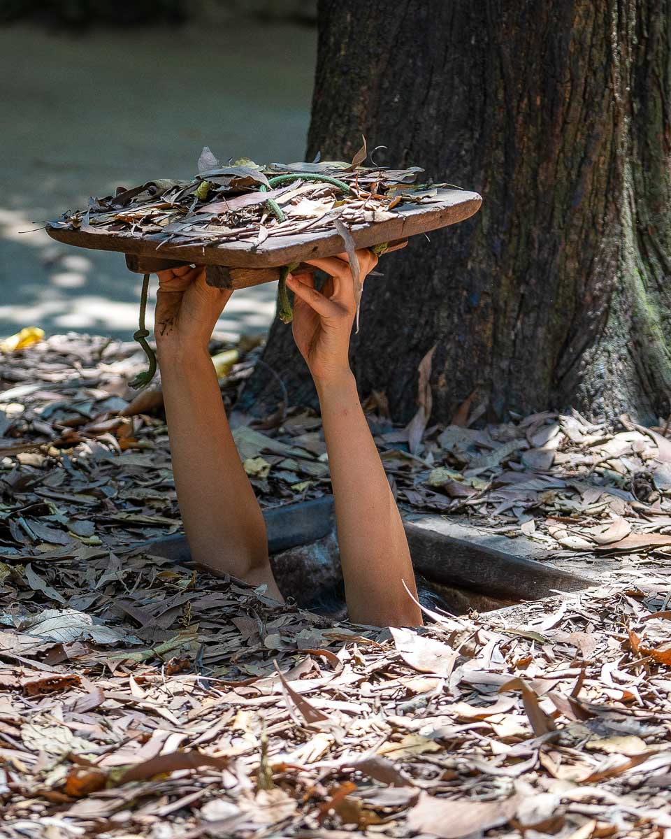 A person in the Cu Chi Tunnels on a tour from Saigon Ho Chi Minh Vietnam