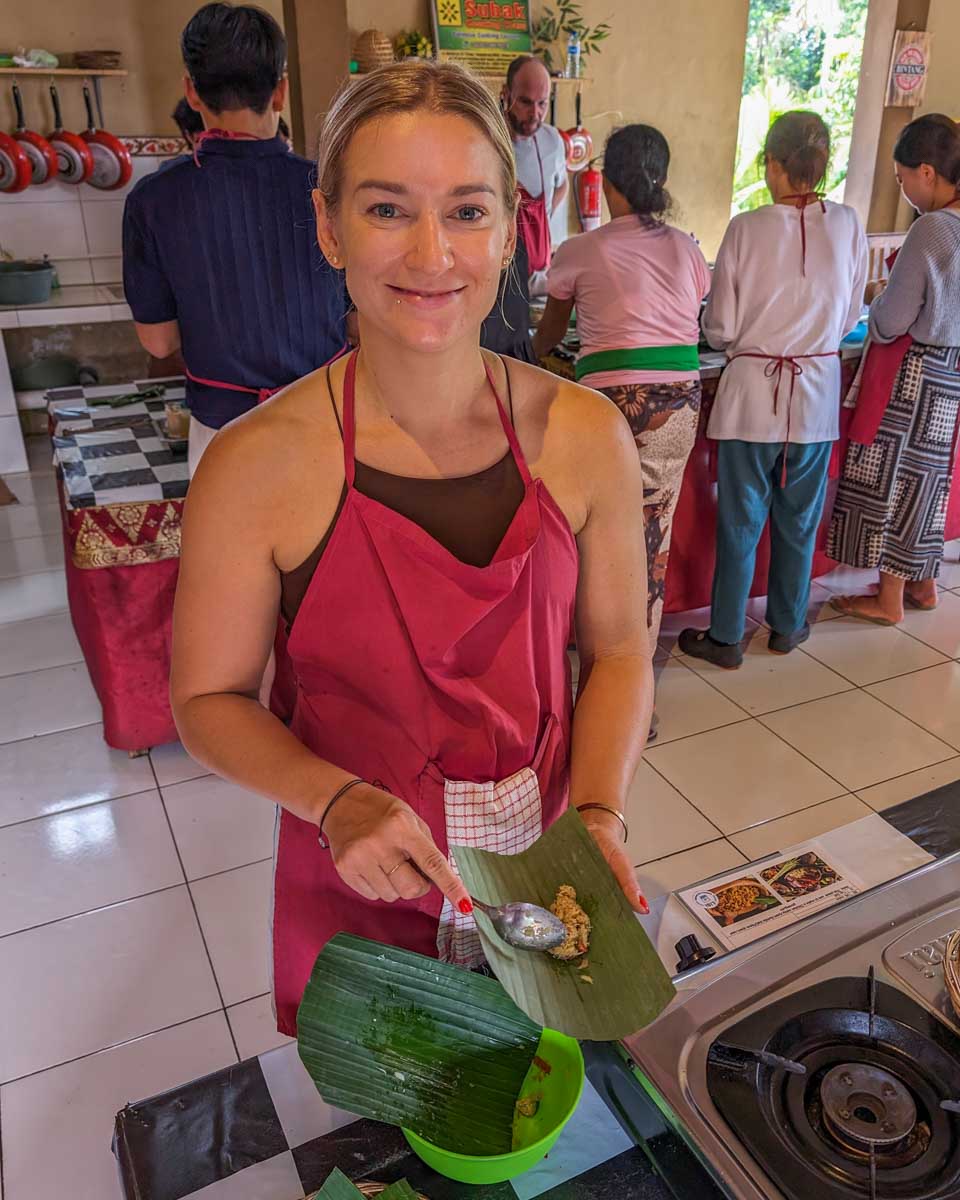 Bailey-wraps-food-in-banana-leaves-during-a-cooking-class-in-Phuket Thailand