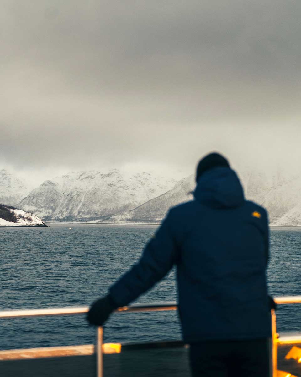 Daniel looks at a fjord on a cruise in Tromso Norway
