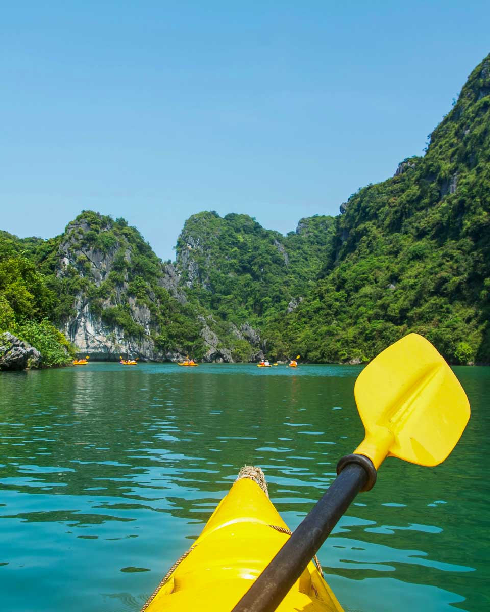 Kayaking through Ha Long Bay on a cruise in Vietnam