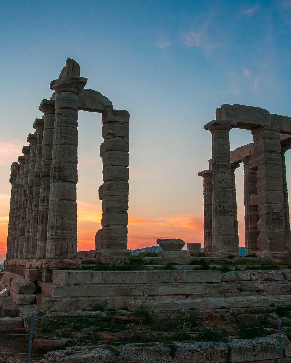 The temple of poseidon at sunset on a tour from Athens Greece
