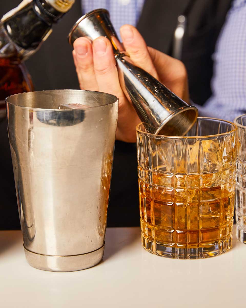 A person makes a cocktail during a mixology tour in San Juan Puerto Rico