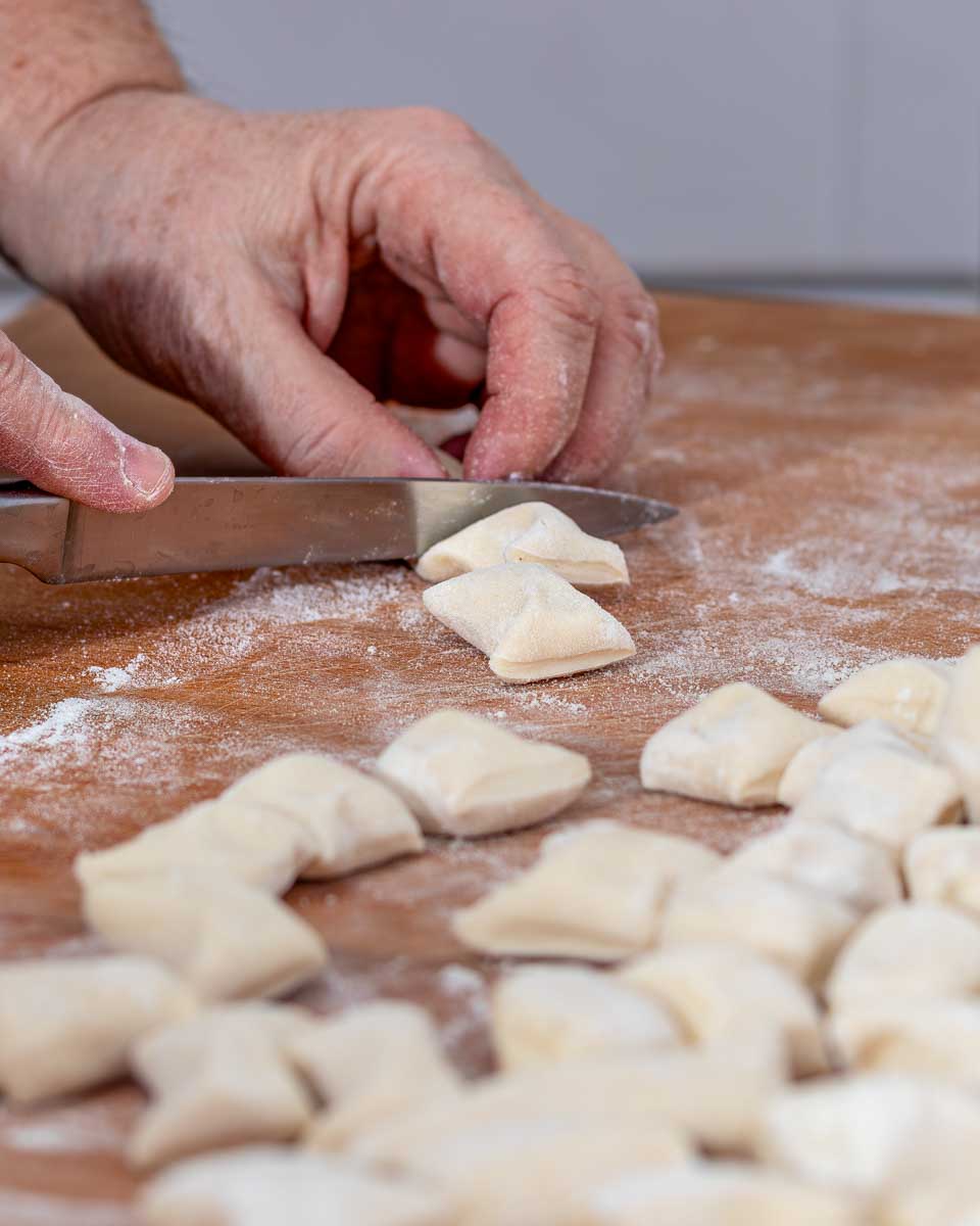 A person makes gnocchi during a cooking class in Milan Italy
