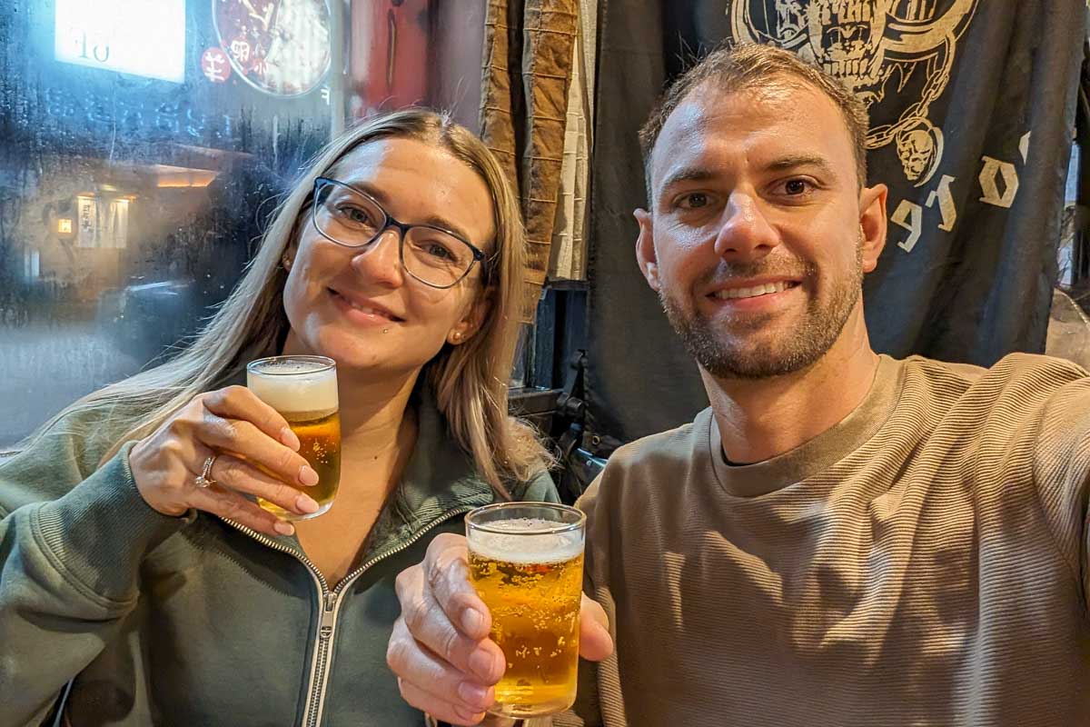 Bailey-and-Daniel-take-a-selfie-while-holding-two-drinks-in-Beijing China