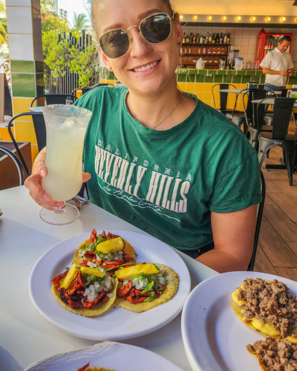 Bailey-with-her-tacos-and-margarita-on-a-taco-tour-in-Mexico City Mexico